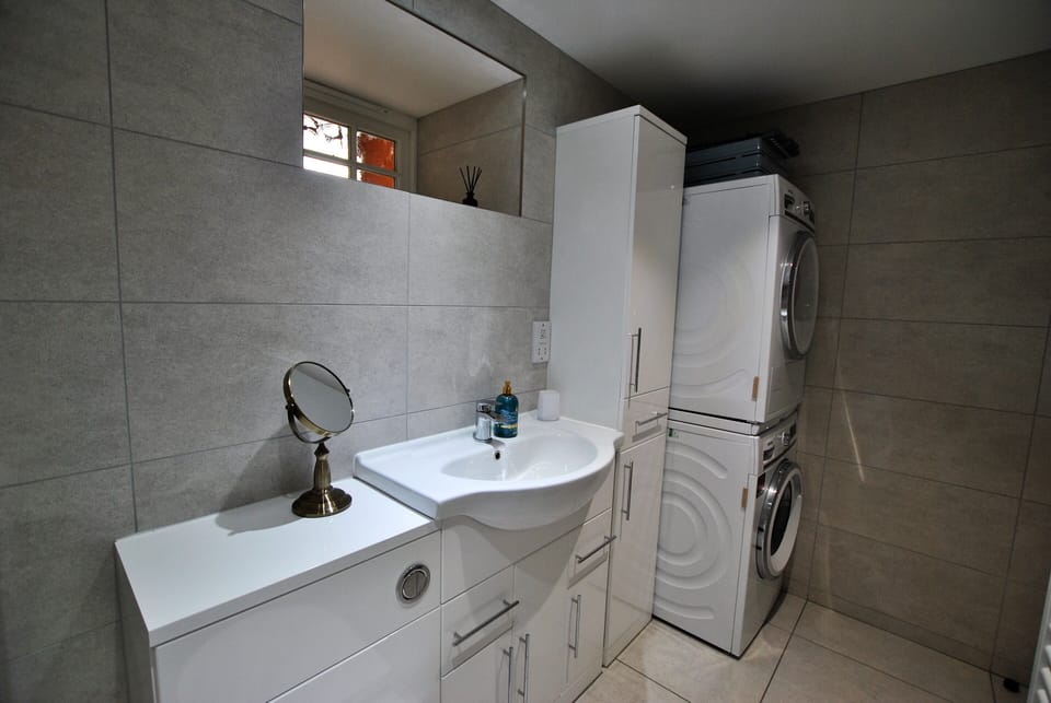 A useful utility area has been added to the en-suite
