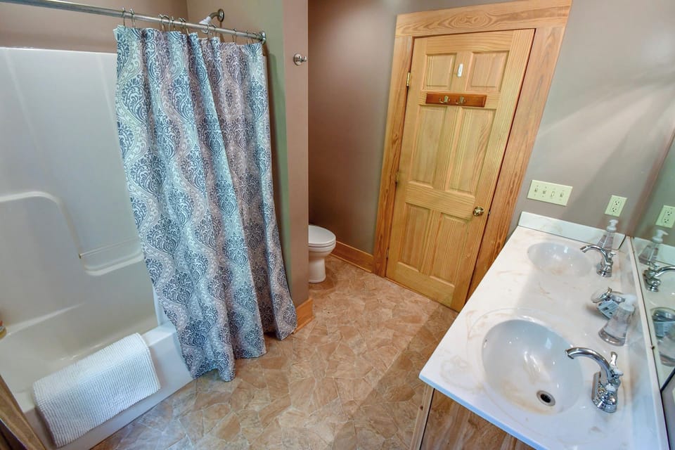 2 of 3 full size bathrooms with double sinks
