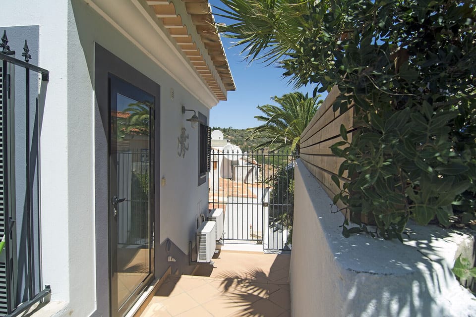 The entrance to Casa Sereia Mar is via a narrow path behind the house.
