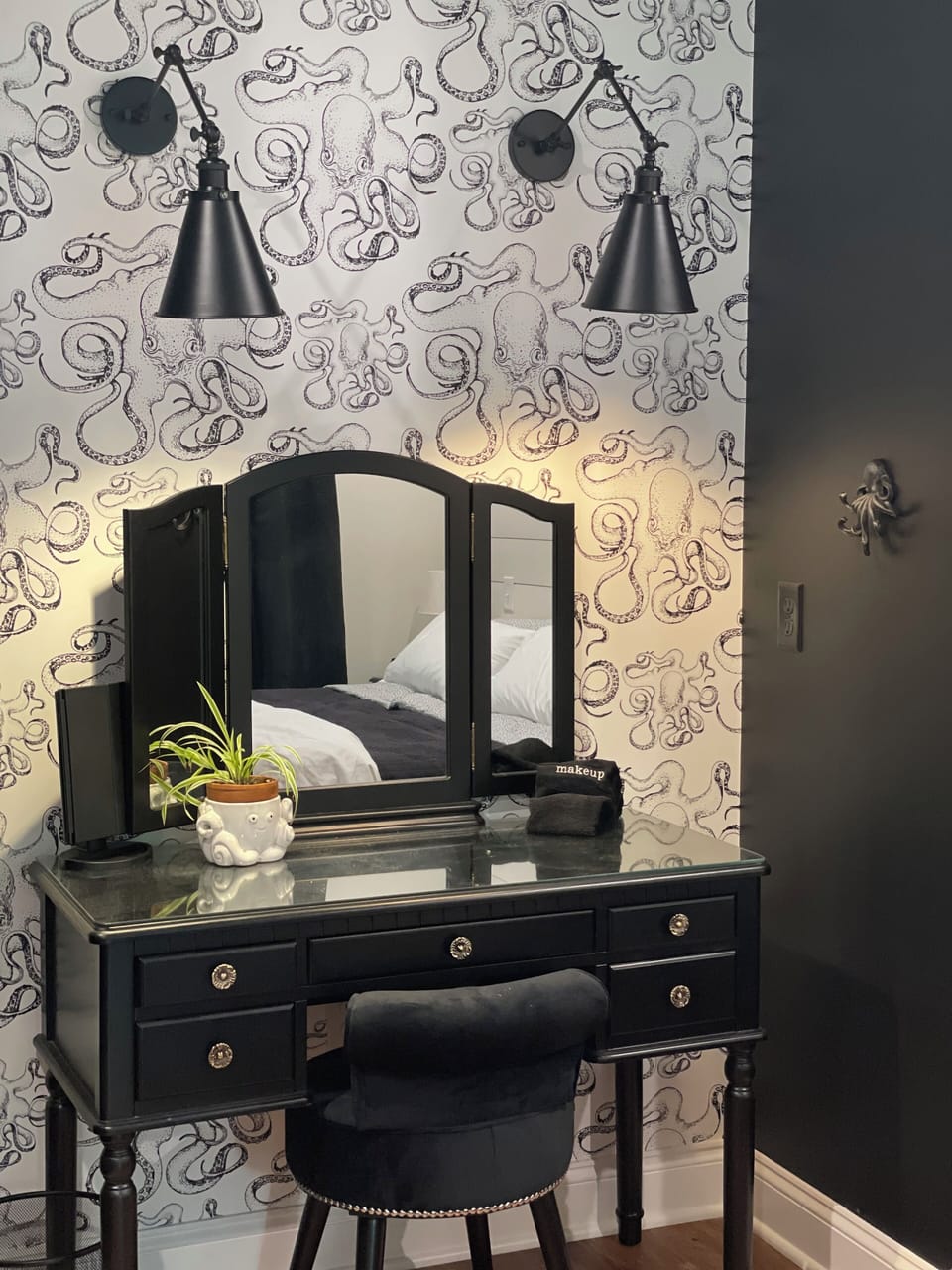 Makeup vanity in back bedroom with additional magnifying mirror, extra outlets