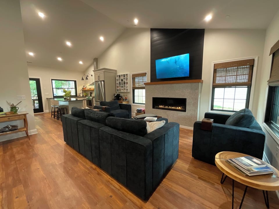 Open space living room and kitchen with cathedral ceilings