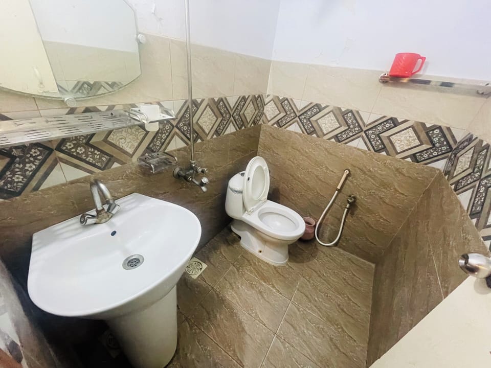 Shower, slippers, towels, soap