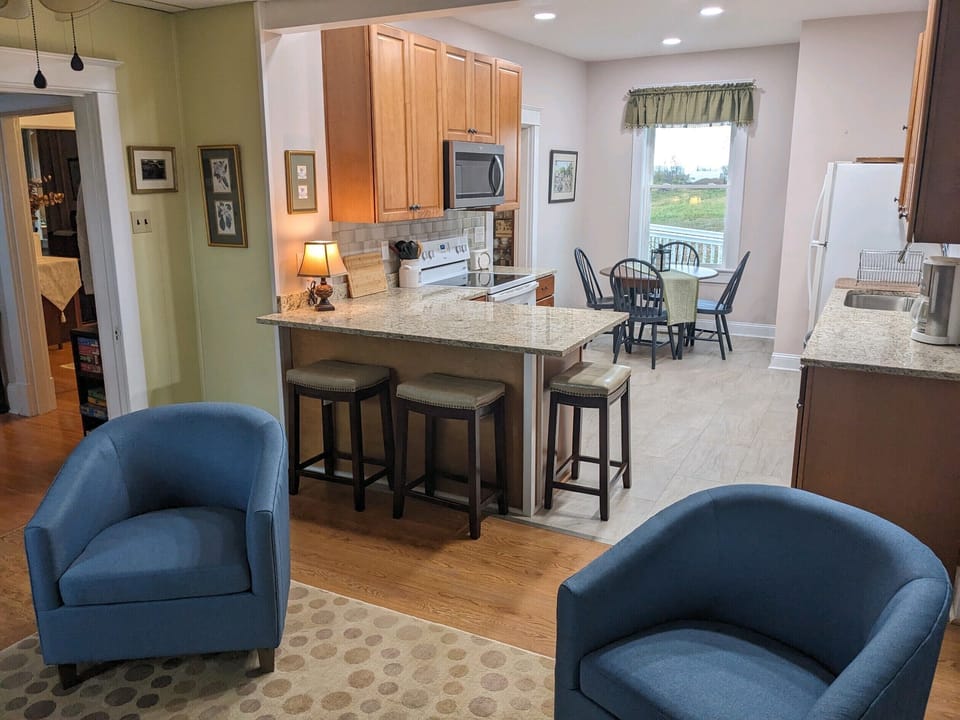 Kitchen with seating for 3 at the counter and 4 at the table.  