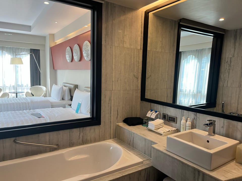 Deluxe Room, 2 Twin Beds | Bathroom | Separate tub and shower, hair dryer, bathrobes, slippers