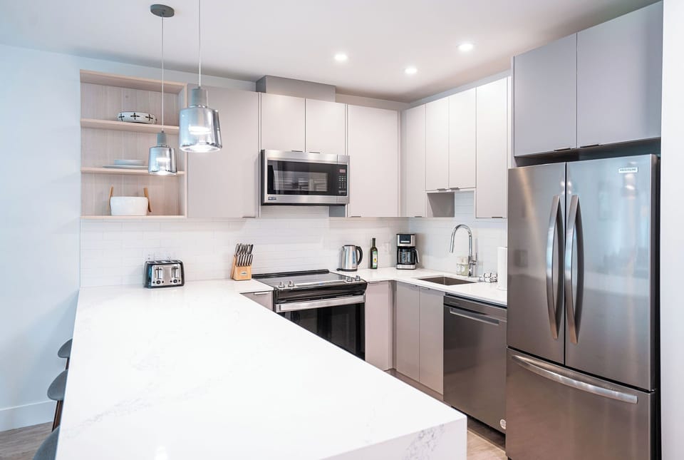 Condo | Private kitchen | Coffee/tea maker, full-size fridge, microwave, oven