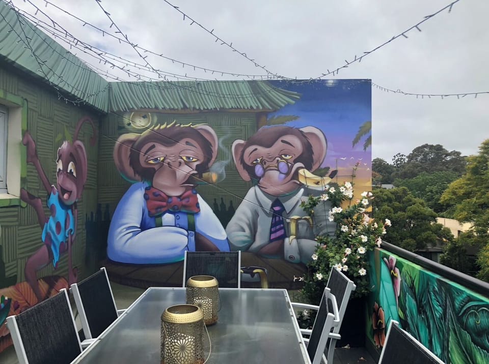 Outdoor balcony from Primary Bedroom, street art