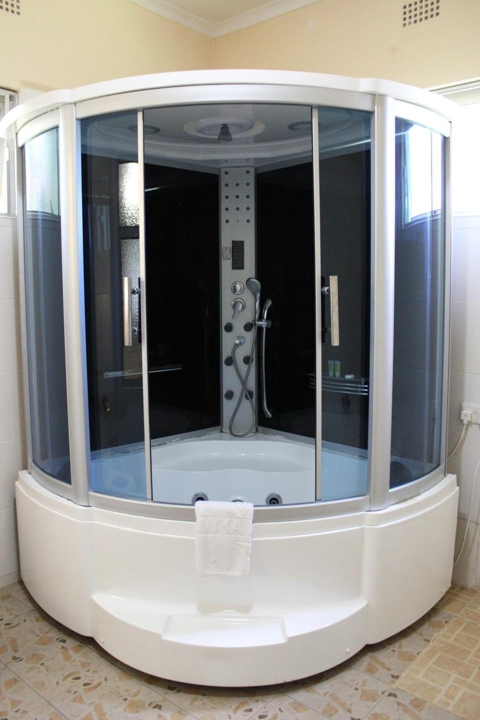 Combined shower/tub, free toiletries, hair dryer, slippers