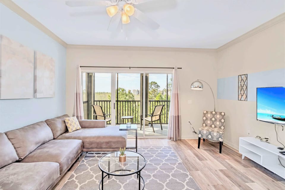 Living room with smart TV and direct patio access 