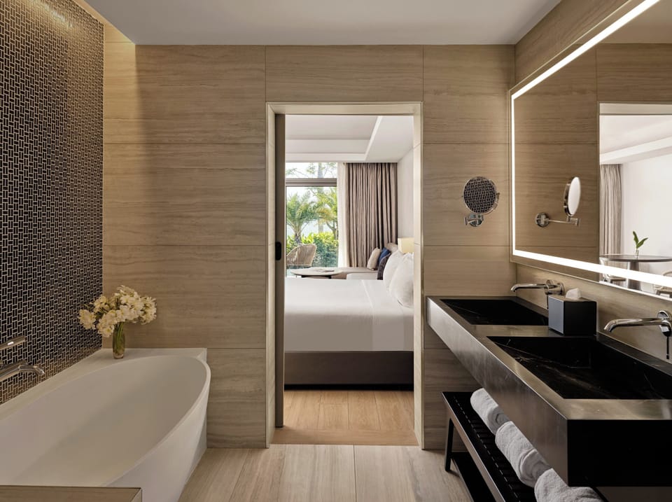 Combined shower/tub, bathrobes, slippers, towels