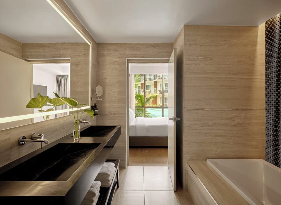 Combined shower/tub, bathrobes, slippers, towels