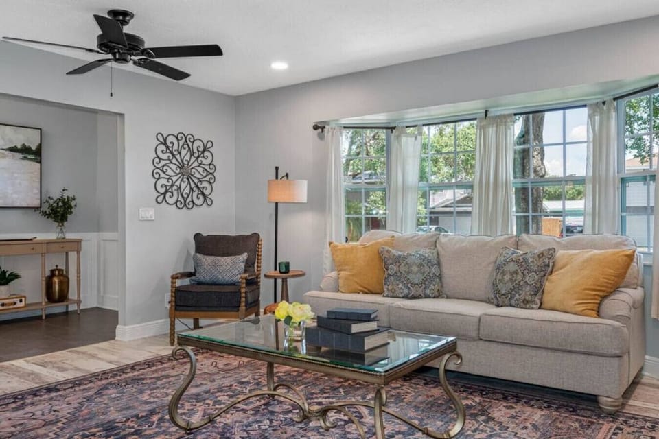 The warm and spacious living room greet you immediately upon entry.