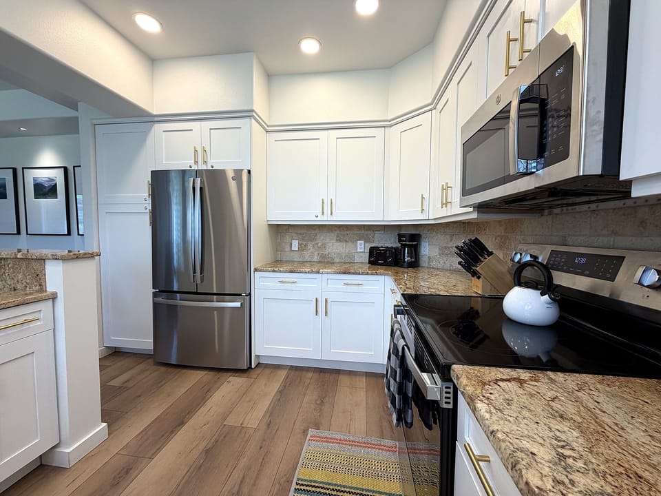 The full kitchen is well stocked with your cooking & baking needs