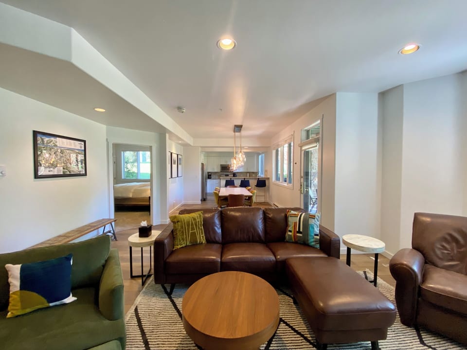 The great room (living space > dining area > kitchen); open floor plan