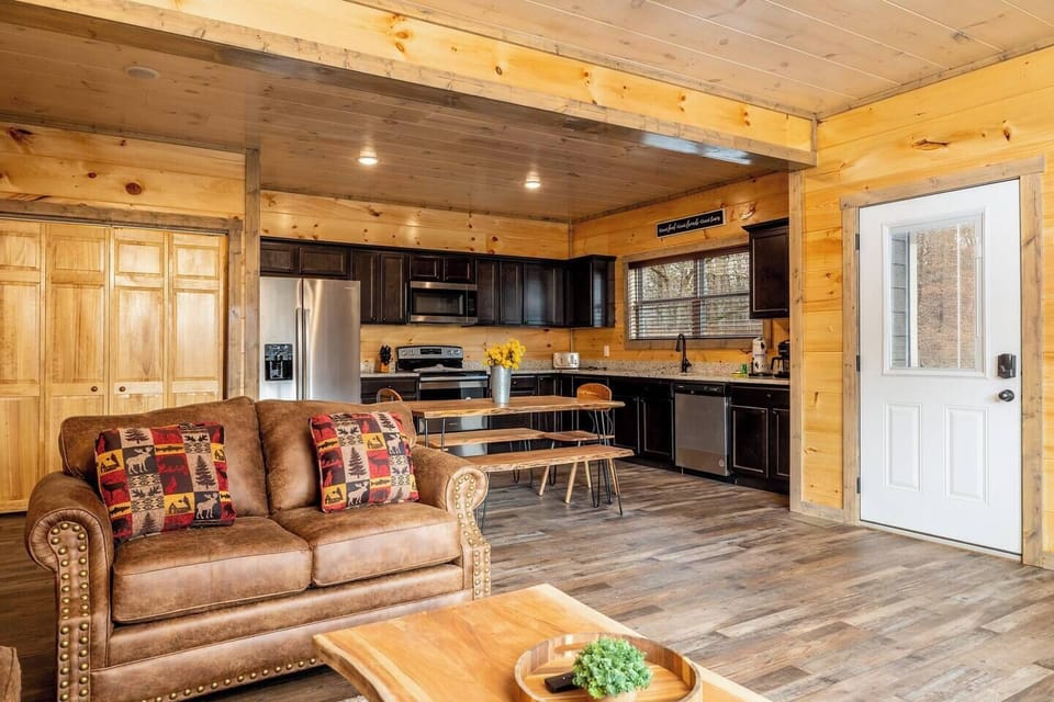 Open living, dining, and kitchen area ideal for socializing and enjoying the stocked kitchen!