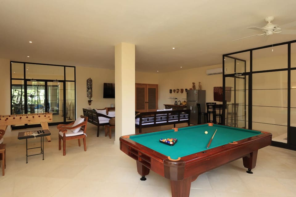 Spacious, fun-packed lounge with pool table, foosball, and comfy seating.