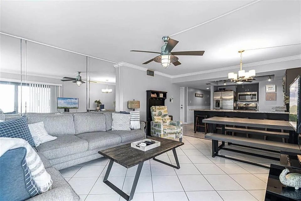 Lounge in our spacious, open-concept living room, direct with balcony access.