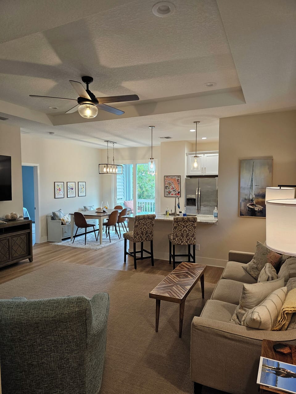 Open floor plan den walking through from front door