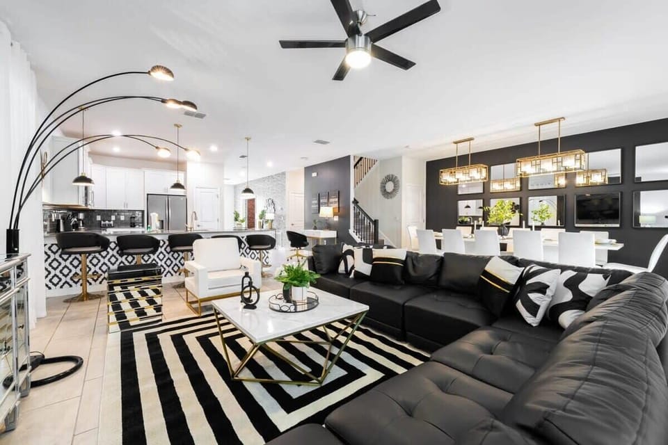 Stylish open-plan living area with chic decor, perfect for entertaining and relaxation. Enjoy modern comforts in a spacious setting.