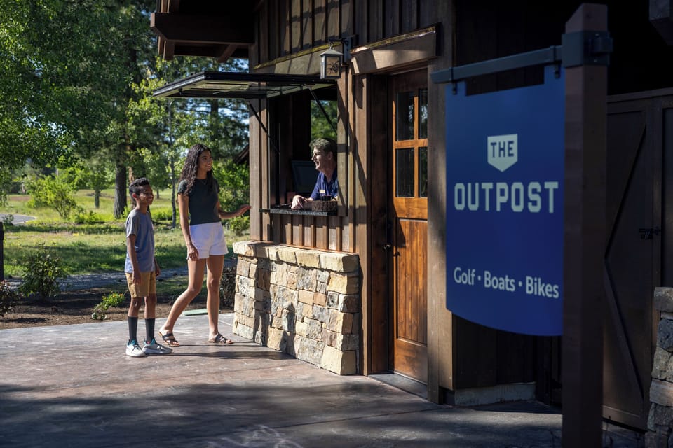 The Outpost marks the gateway to golf, boating, and biking adventures during your stay, set in a natural landscape with lush greenery and warm sunshine.