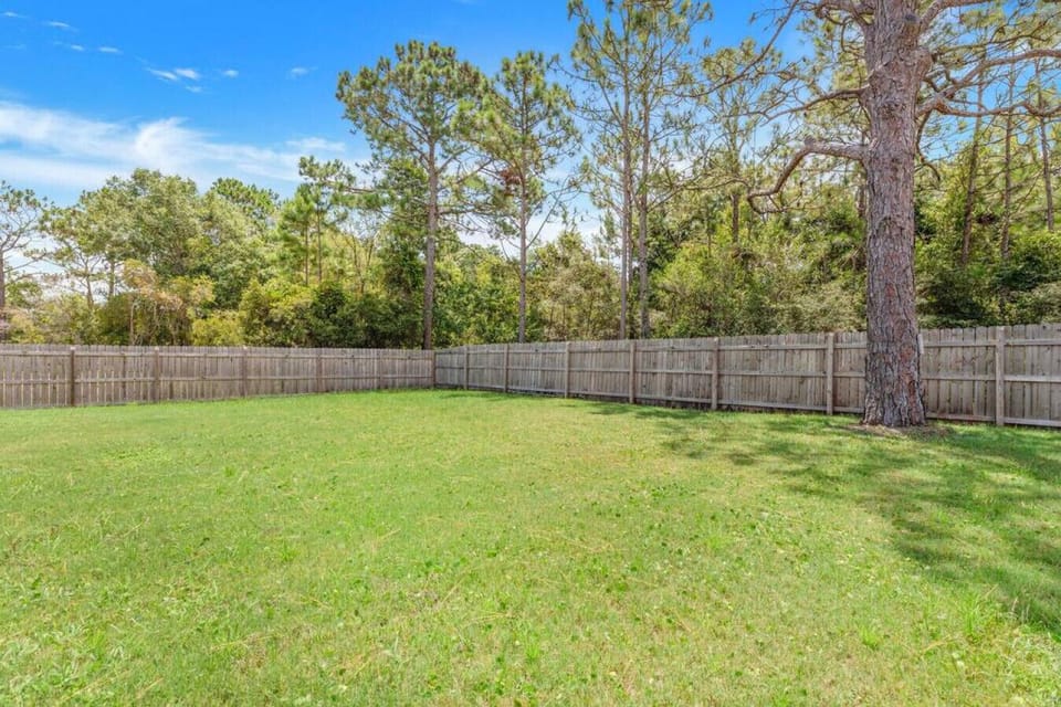Fully fenced-in backyard, recently added a firepit