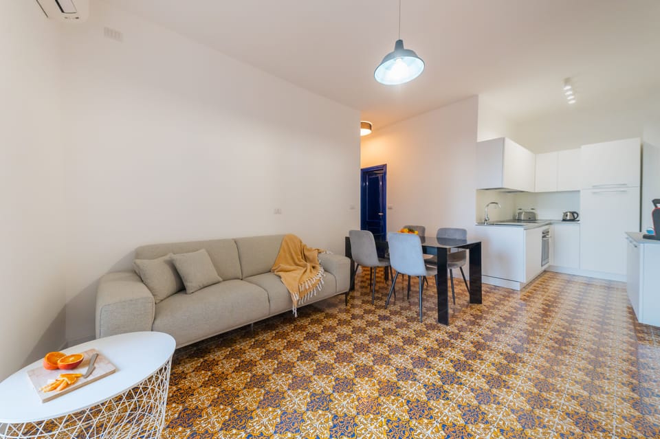 Family Apartment | Living area | 32-inch flat-screen TV with digital channels, Netflix