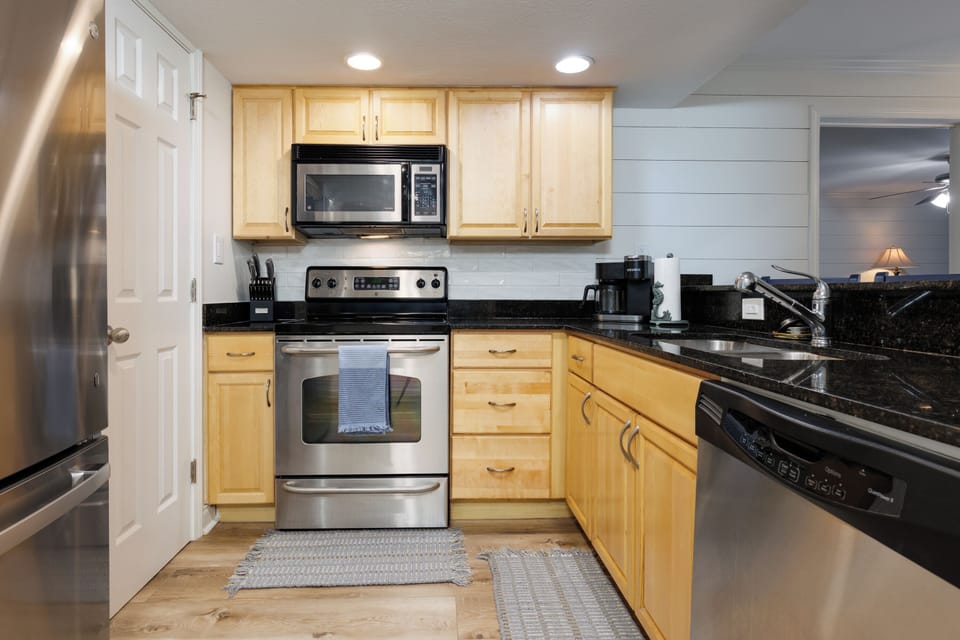Updated appliances and a large pantry await you and your family.
