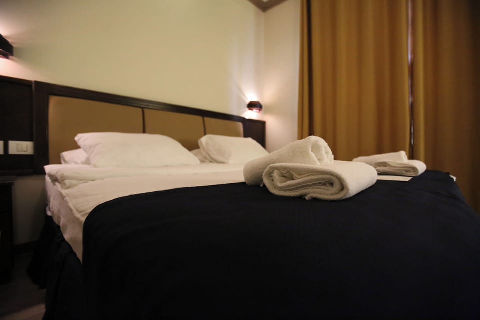 Deluxe Double Room | Minibar, in-room safe, iron/ironing board, travel crib