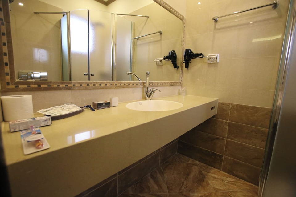 Superior Suite | Bathroom | Shower, hair dryer, towels, soap