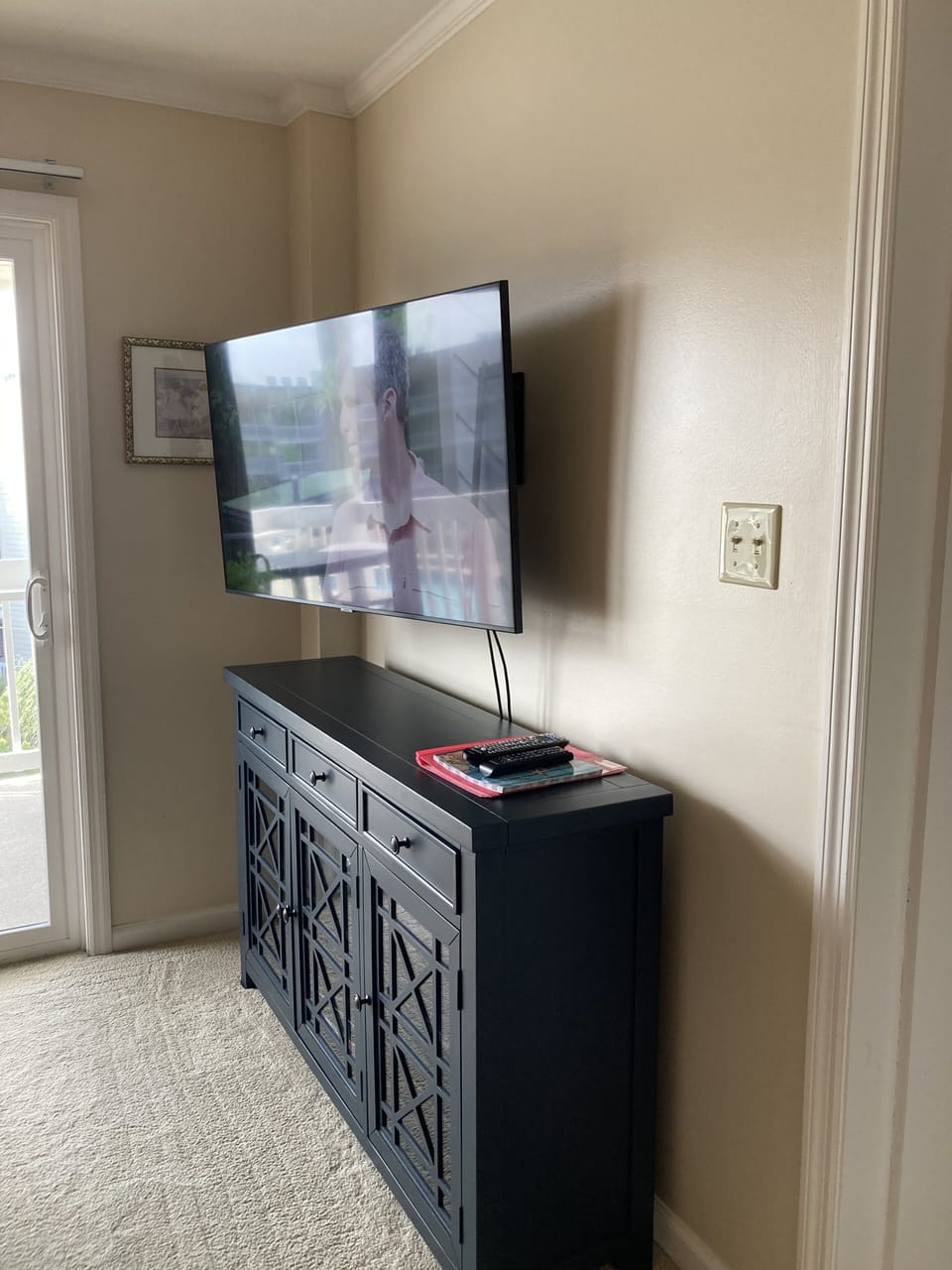 Main living area with large smart TV
Pink folder with info!