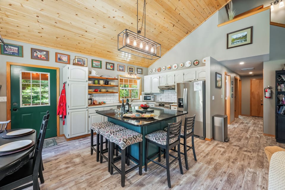 Kitchen has large island with seating for 5