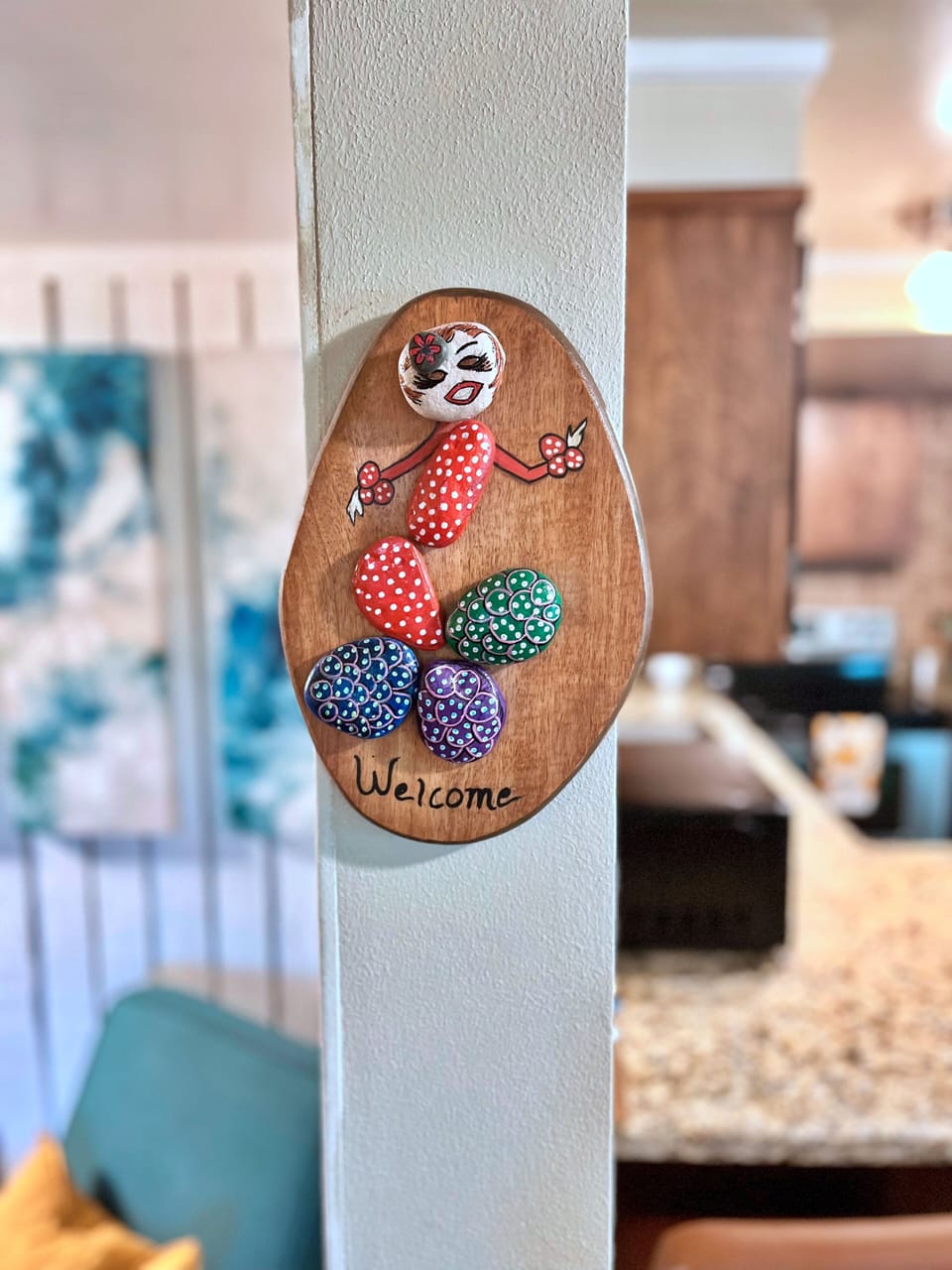 Charming handmade welcome sign in a warm, inviting open living space