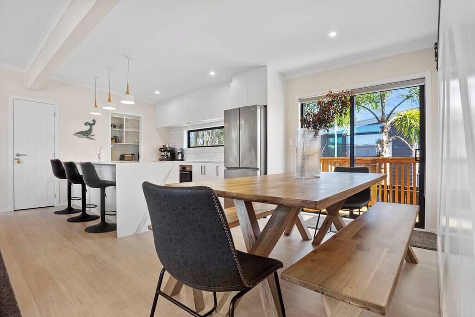 Open plan living, with large dining table.
