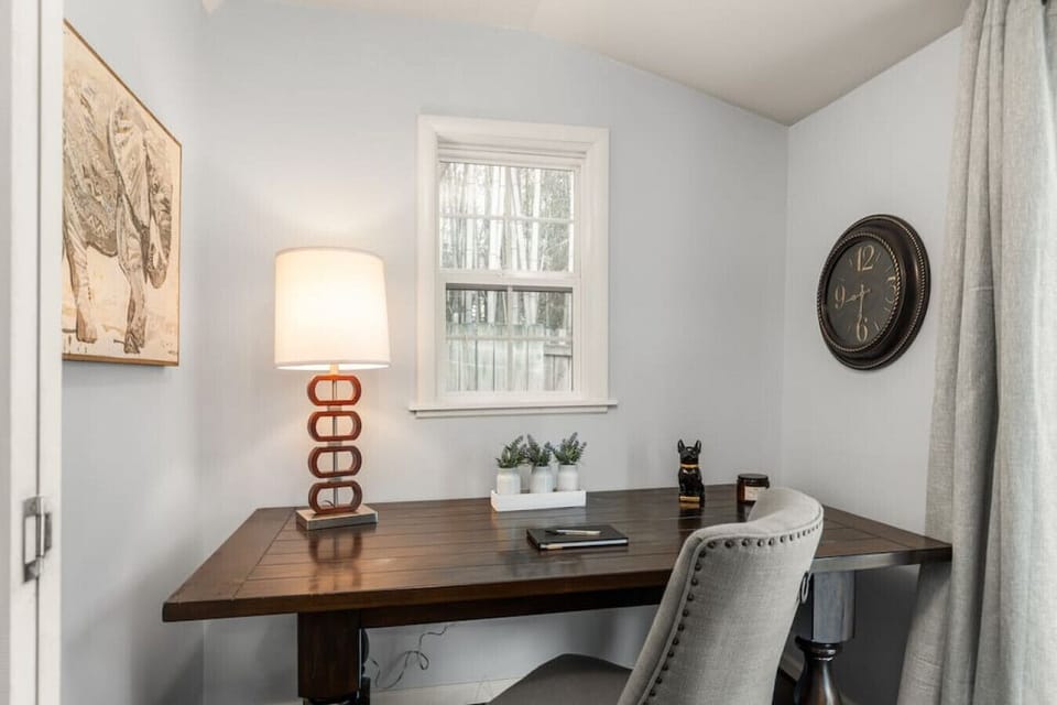 Desk area off of kitchen. Laundry room to the left. Sliding glass doors to the right to the fully fenced in backyard (with bamboo!).