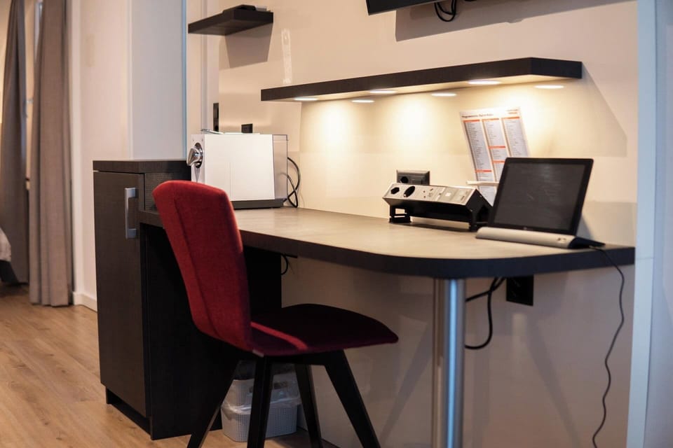 Family Suite (Air Conditioning) | Living area | 32-inch flat-screen TV with cable channels, TV