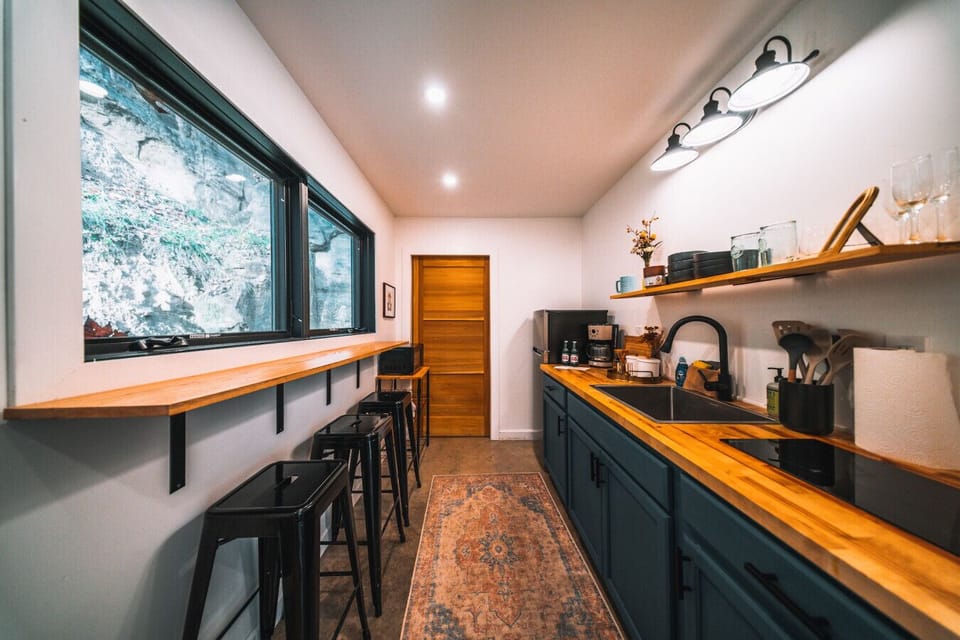 Spacious kitchen ready for your favorite meals during your stay.
