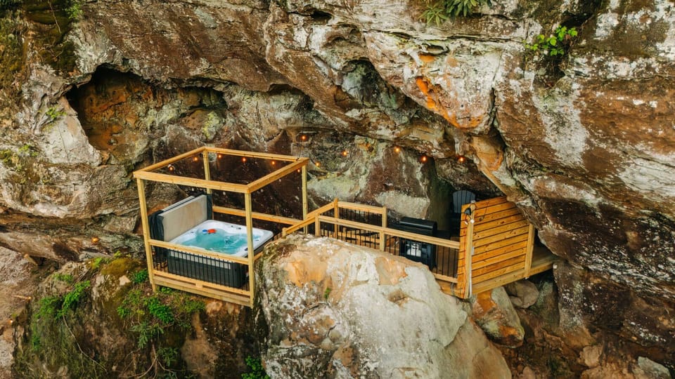 An overhead look at the hot tub deck, tucked into its own alcove in the boulder. Privacy built right into the rock.