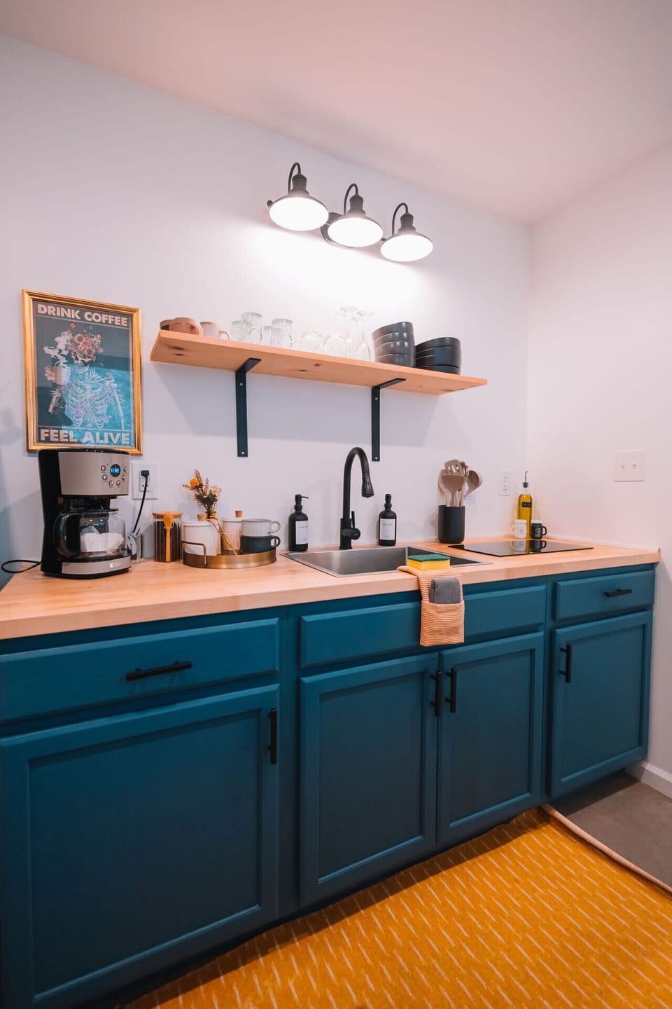 Kitchen with utensils and drip-coffee maker for a morning boost.