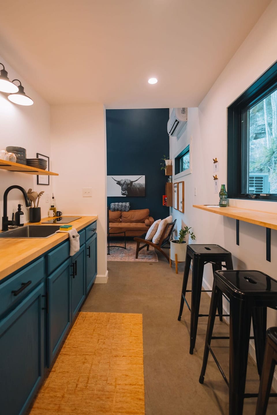 Move easily from the stylish kitchen into the cozy sitting area, made for laid-back cabin nights together