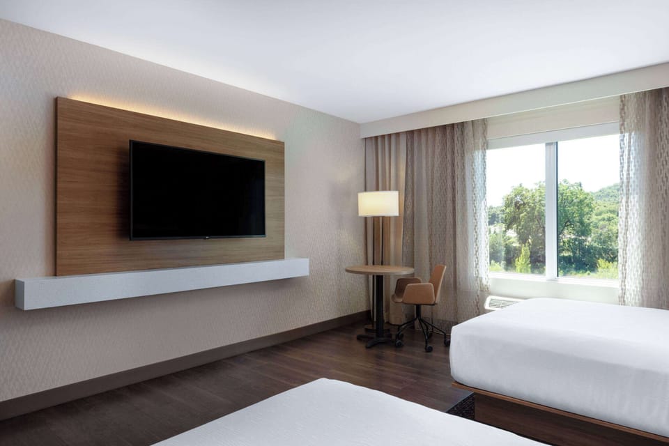 Premium bedding, pillowtop beds, blackout drapes, soundproofing