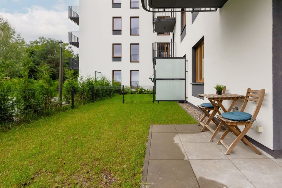 A private garden area with seating, perfect for outdoor relaxation and enjoying the greenery.
