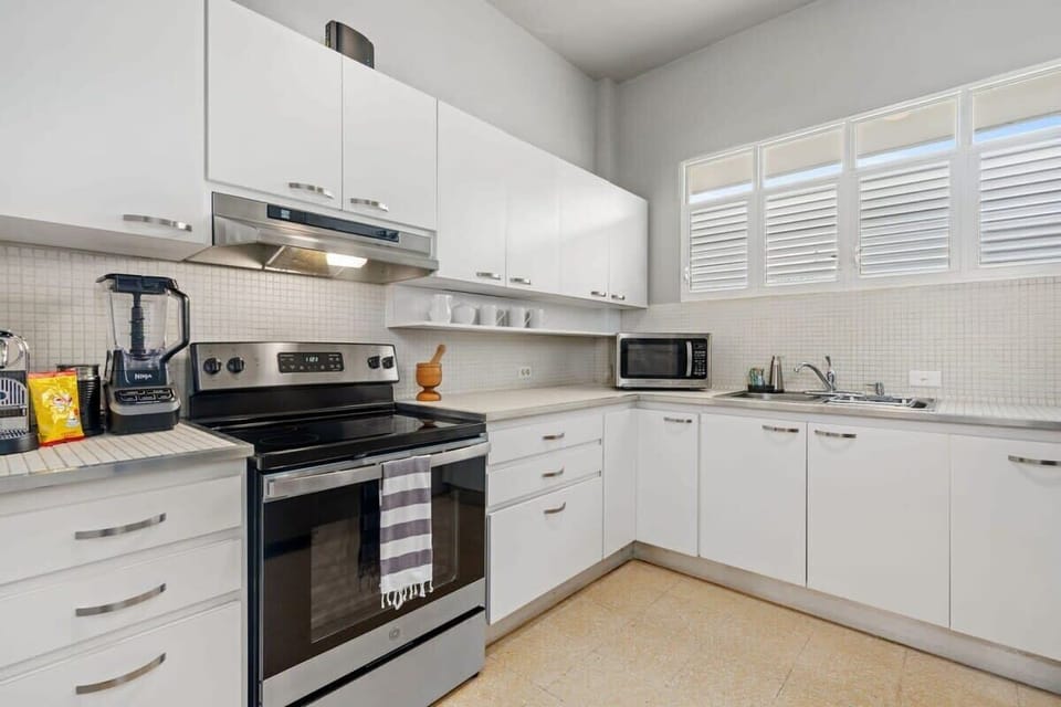 The kitchen at the main house feature a stove, oven, fridge, microwave and coffee maker