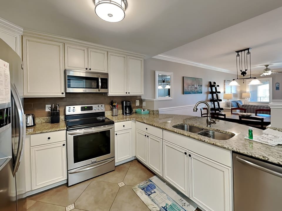 The fully-equipped kitchen with stainless appliances