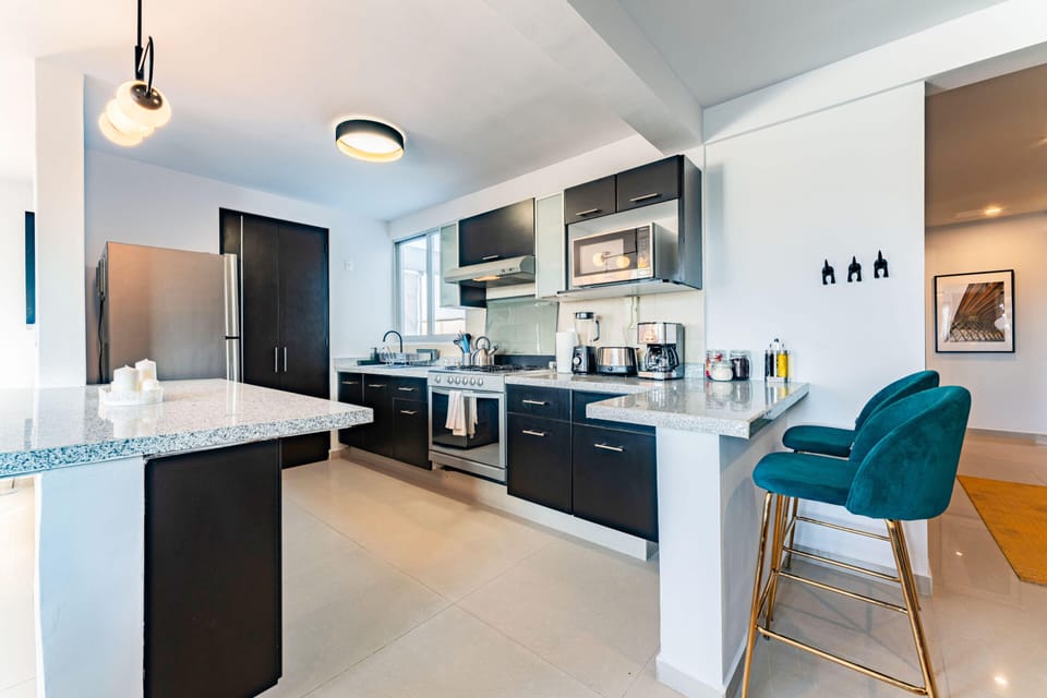 Spacious kitchen with modern appliances and style.