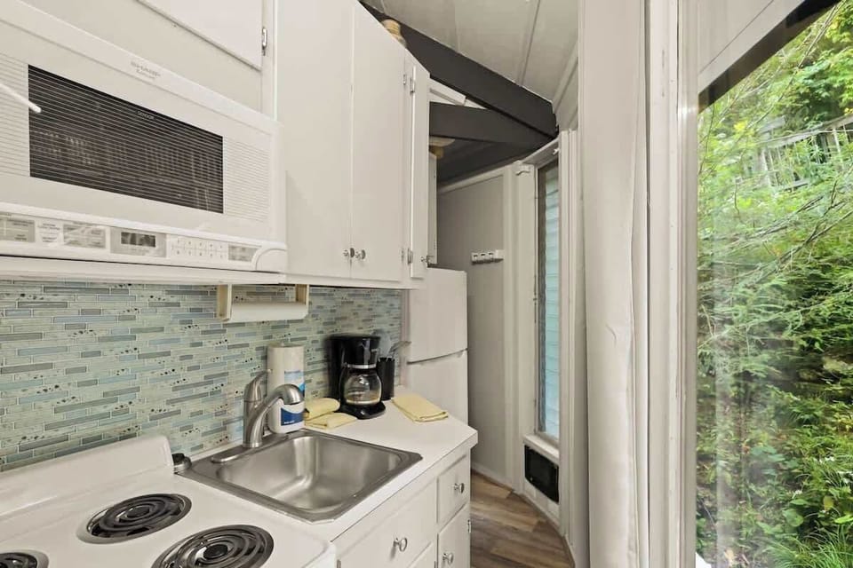 Step into a contemporary white kitchen, a sleek and stylish space for culinary inspiration.
