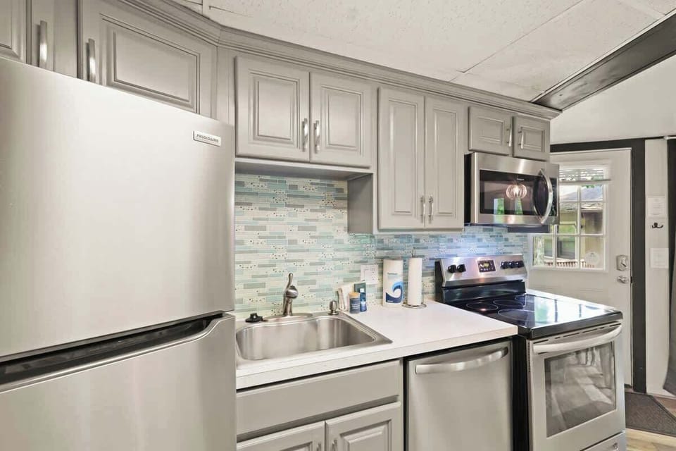 Discover the joy of cooking in our fully equipped kitchen, featuring everything you need for a delightful culinary experience.