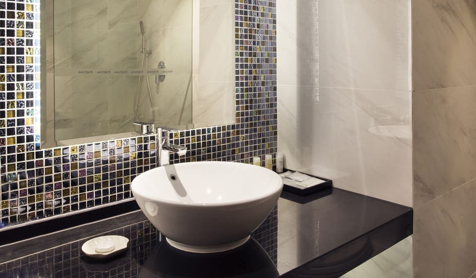 Shower, rainfall showerhead, designer toiletries, hair dryer