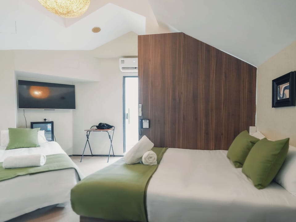 Family Suite With Patio | Minibar (free items), WiFi (free), bed sheets