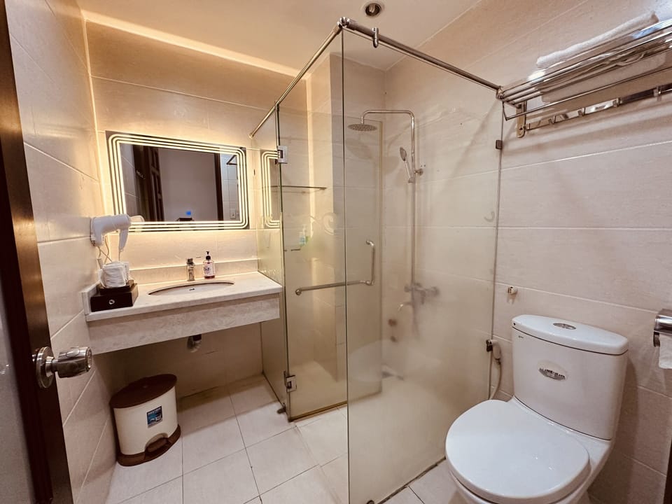 City Quadruple Room | Bathroom | Combined shower/tub, rainfall showerhead, designer toiletries
