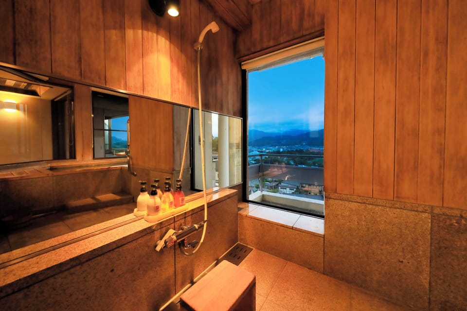 Separate tub and shower, free toiletries, hair dryer, slippers
