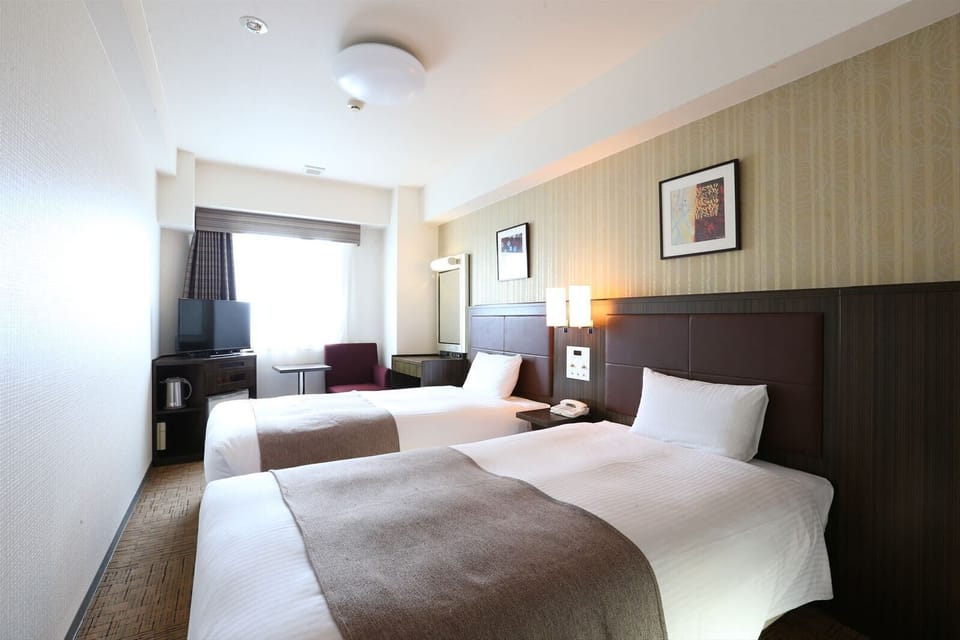 Twin Room, Non Smoking | Down comforters, desk, blackout drapes, free WiFi